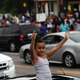 A young girl protesting the shooting death of teenager Michael Brown by police is seen with her hands in the air Aug. 17, 2014, in Ferguson, Mo.
Joshua Lott/Getty Images